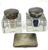 A PAIR OF GEORGE V SILVER-MOUNTED GLASS INKWELLS, ASPREY & CO. LTD., LONDON, 1928 / 29