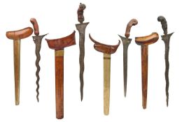 FOUR MALAYSIAN DAGGERS (KRIS), LATE 19TH/EARLY 20TH CENTURY