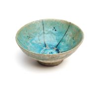 A TURQUOISE GLAZED BOWL, EASTERN IRAN, CIRCA 12TH CENTURY