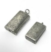 A VICTORIAN SILVER MINIATURE COMBINED VESTA CASE AND CHEEROOT CUTTER AND ANOTHER VESTA CASE, BOTH AL