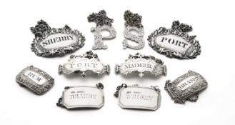 FIVE PAIRS OF GEORGIAN AND VICTORIAN SILVER WINE LABELS
