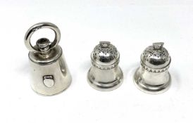 A PAIR OF VICTORIAN SILVER 'BELL WEIGHT' PEPPERETTES AND A PEPPER GRINDER, LONDON, 1885 / 86 RESPECT