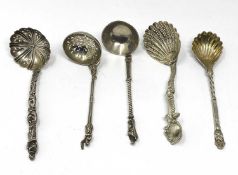 A GROUP OF FOUR VICTORIAN SILVER DECORATIVE SPOONS, VARIOUS MAKERS, ALL LONDON, 1845-74