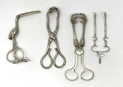 THREE PAIRS OF VICTORIAN SILVER TONGS AND A PAIR OF RIBBON PULLERS, VARIOUS MAKERS, ALL LONDON, 1879