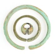 THREE ITEMS OF ANCIENT BRONZE JEWELLERY, PROBABLY JAVA, 9TH/10TH CENTURY