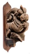 AN ARCHITECTURAL BRACKET IN THE FORM OF A MYTHICAL LION, SOUTH INDIA, 19TH CENTURY