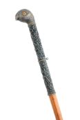 AN ANGLO-INDIAN SILVER MOUNTED CANE, SOUTH INDIA, CIRCA 1900