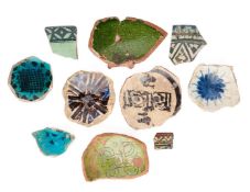 A COLLECTION OF EARLY ISLAMIC POTTERY SHARDS, 11TH-14TH CENTURIES