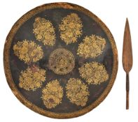 A NORTH INDIAN SHIELD (DHAL), 19TH CENTURY, AND A SUDANESE SPEARHEAD