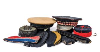 A GROUP OF NINE BRITISH MILITARY HEADGEAR, 19TH CENTURY AND LATER