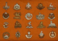 A COLLECTION OF 20 METAL BRITISH MILITARY CAP BADGES