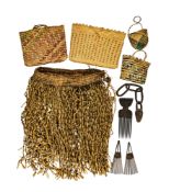 A WOVEN SKIRT, THREE COMBS, A WOODEN CHAIN, AND FOUR WOVEN BAGS