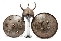 AN INDIAN HELMET (TOP) AND TWO INDIAN SHIELDS (DHAL), 19TH CENTURY AND LATER