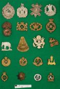 A COLLECTION OF 20 METAL MILITARY BADGES