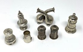 A GROUP OF SIX SMALL VICTORIAN SILVER PEPPERETTES, VARIOUS MAKERS, LONDON AND BIRMINGHAM, 1878-1889