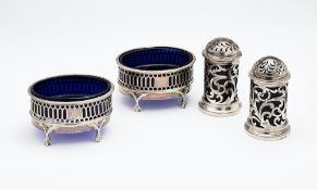 A PAIR OF VICTORIAN PIERCED SILVER SALT CELLARS AND A PAIR OF PEPPERETTES