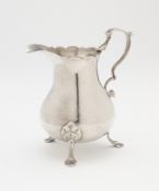 A GEORGE II SILVER MILK JUG, MAKER'S MARK RUBBED ?.H, LONDON, 1749