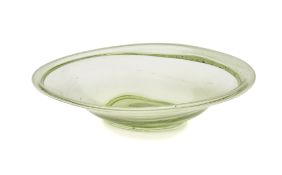 A ROMAN MOSS GREEN GLASS OVAL DISH, CIRCA 4TH-5TH CENTURY A.D.