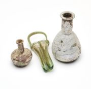 THREE ROMAN GLASS VESSELS, CIRCA 2ND-4TH CENTURY A.D.