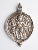 A SILVER AMULETIC PENDANT DEPICTING BHAIRAVA, WESTERN INDIA, CIRCA 18TH CENTURY