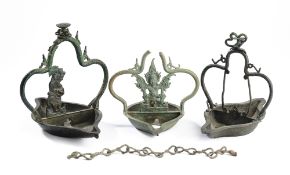 THREE JAVANESE BRONZE HANGING LAMPS, INDONESIA, CIRCA 14TH CENTURY