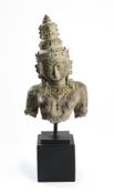 A JAVANESE COPPER REPOUSSE BUST OF A GODDESS, INDONESIA