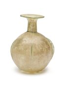 A ROMAN PALE GREEN GLASS SPRINKLER FLASK, CIRCA 3RD-4TH CENTURY A.D.