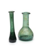 TWO ROMAN DARK GREEN GLASS UNGUENTARIA, CIRCA 2ND CENTURY A.D.