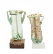 TWO ROMAN GREEN GLASS DOUBLE BALSAMARIA, CIRCA 4TH CENTURY A.D.