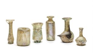 SIX ROMAN GLASS VESSELS, CIRCA 1ST-4TH CENTURY A.D.