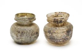 TWO ROMAN COLOURLESS GLASS JARS, CIRCA 4TH CENTURY A.D.