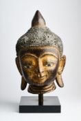 A GILT LACQUER HEAD OF BUDDHA, BURMA (NOW MYANMAR), 19TH CENTURY