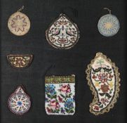 A COLLECTION OF SEVENTEEN QAJAR PURSES, PERSIA, 19TH CENTURY