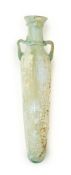 A ROMAN PALE GREEN ELONGATED GLASS FLASK, CIRCA 3RD-4TH CENTURY A.D.