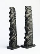 A PAIR OF HAIDA ARGILLITE TOTEM POLES, NORTHWEST COAST OF AMERICA, LATE 19TH CENTURY OR LATER