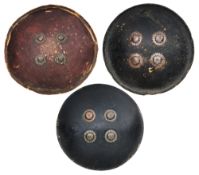 THREE INDIAN CIRCULAR HIDE SHIELDS (DHALS), 19TH CENTURY