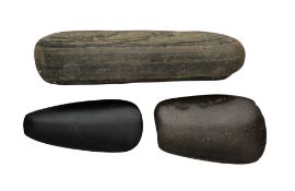 THREE STONE AXE HEADS