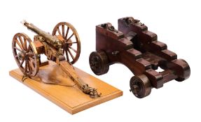 A CARRIAGE OF NAVAL TYPE FOR A SIGNAL CANNON, 19TH CENTURY, AND A MODEL FIELD GUN