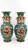 A large pair of Chinese cloisonné enamel vases - with dragon motifs and elephant-shaped handles