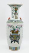 A Chinese Qianjiang and Famille Rose decorated porcelain vase - with decor of valuables and antiques