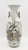 A Chinese Qianjiang cai decorated porcelain vase - decorated with a garden scene of two ladies and a