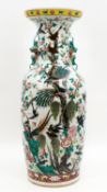 A Chinese Famille Rose richly decorated porcelain vase - decorated with blackbirds, pheasants, and p