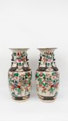 A Chinese pair of Nankin crackle-glazed vases - decorated with warriors