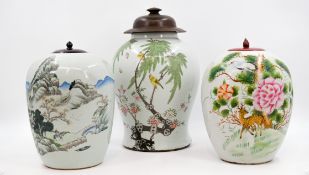 A composed lot of three Chinese Qianjiang and Famille Rose variously decorated porcelain covered vas
