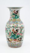 A Chinese Famille Rose decorated porcelain vase - with decor of roosters and flora