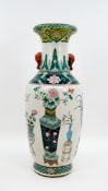 A Chinese finely Famille Verte decorated porcelain vase with valuables and antiques