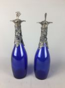 Pair of Bristol Blue glass decanters with grape and vine decoration 