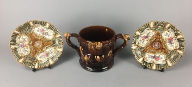 Large Twin Handled Treacle Glazed Loving Cup and a Pair of Victorian Alhambrian "Tudor Rose" Majolic