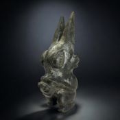 A Chinese carved hardstone figure of a mythical beast. In the Hongshan style. Height - 