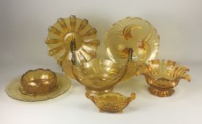 Art Deco Amber Pressed Glass. A Fine Selection to include large platters and an Impressive Centre Pi